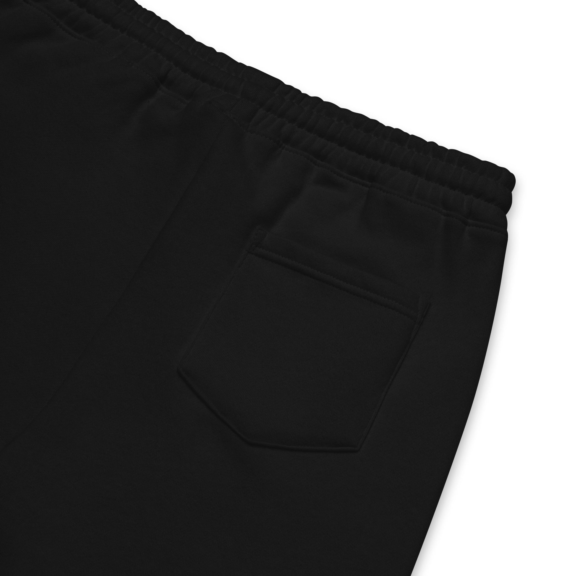 "Detroit Riot Club Archival Jogger Shorts: Close-up of 8.5oz heavyweight hardware featuring the dedicated back utility pocket. Engineered in Detroit for structural durability."