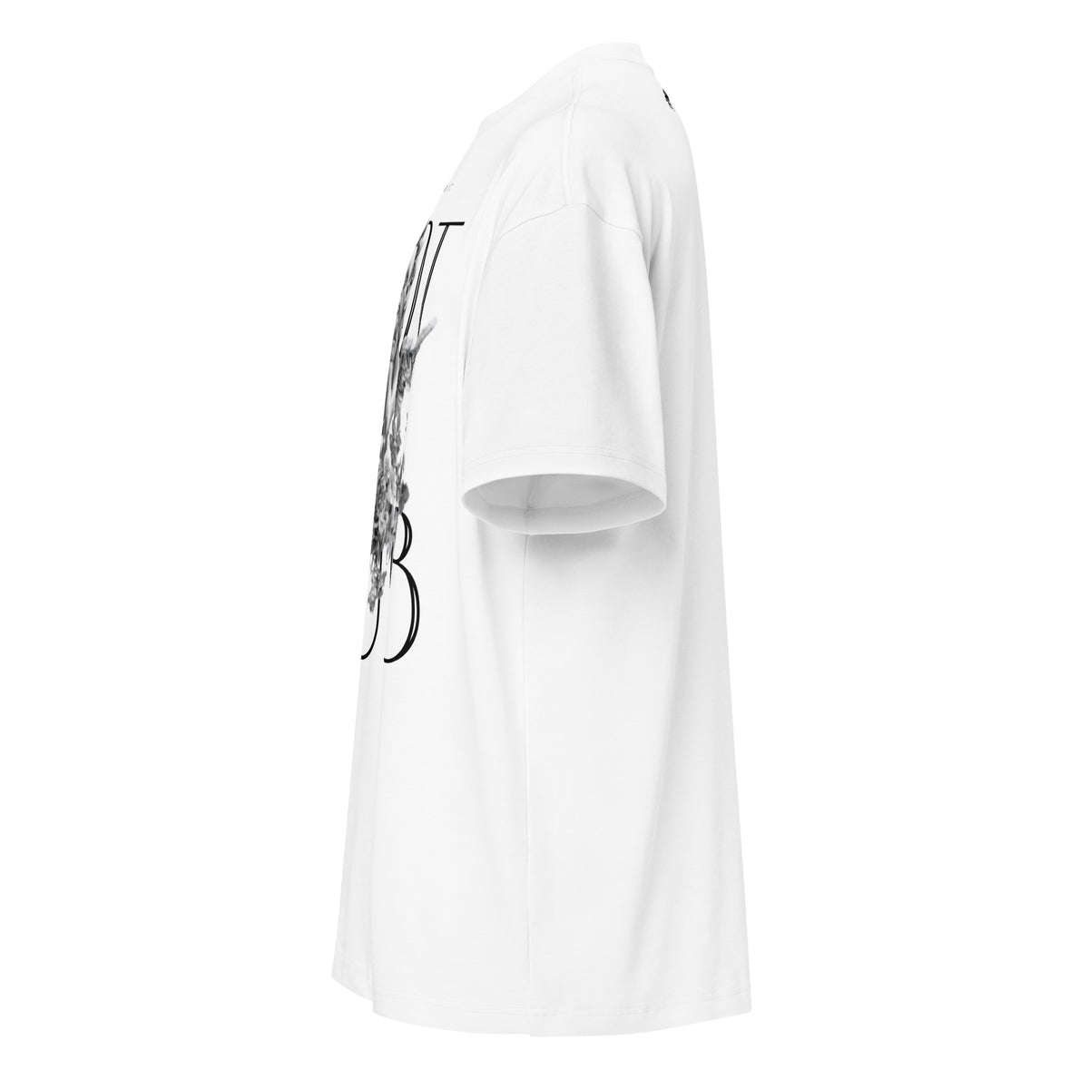 "Left-side profile view of the 7oz oversized box-cut tee in optic white, highlighting the structured shoulder seam, boxy drape, and side graphic placement."