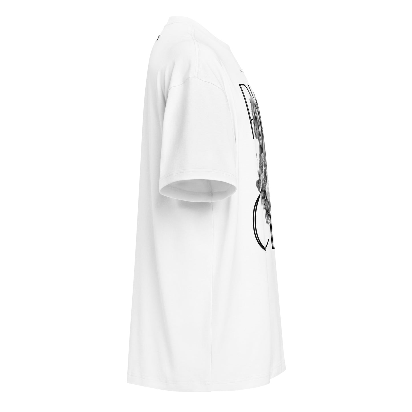"Right-side profile view of the 7oz oversized box-cut tee in optic white, highlighting the structured sleeve drape, boxy fit, and side graphic placement."