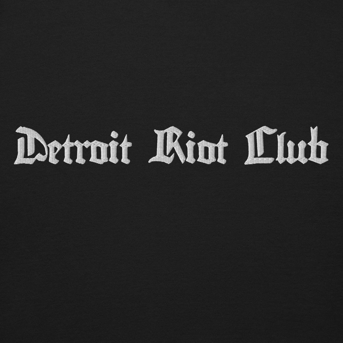 "Close-up of the 8.5oz heavyweight fleece fabric surface in void black, showing the detailed texture and high-density knit."